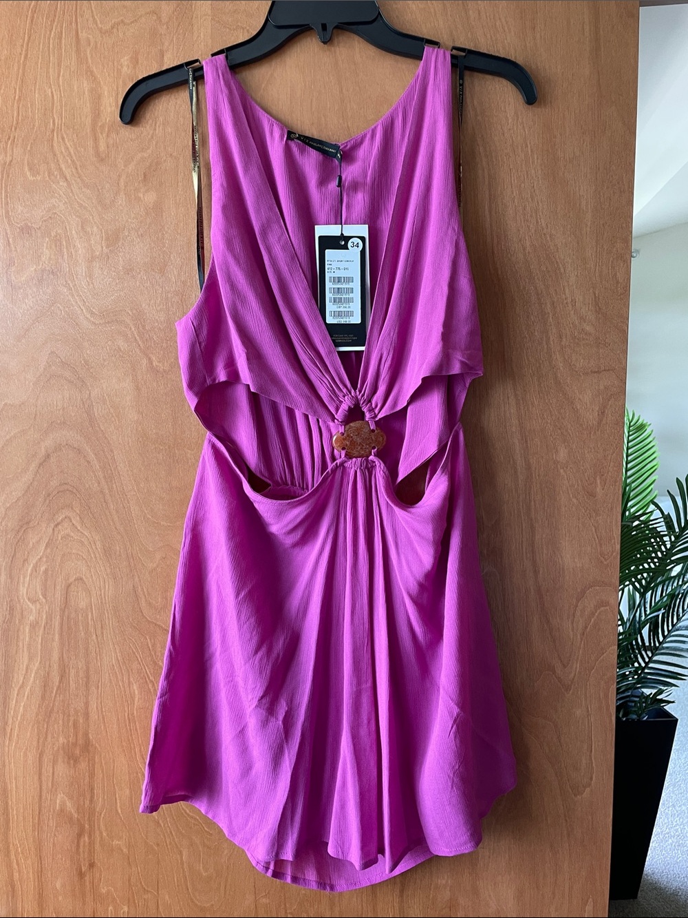 Sleeveless Cutout Mini Dress in Fuchsia with Knot Detail